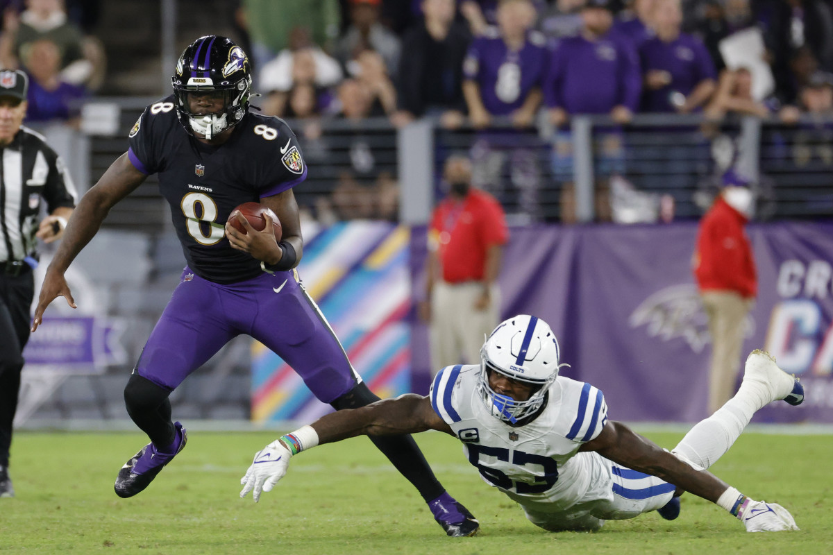 Oct 11, 2021; Baltimore, Maryland, USA; Baltimore Ravens quarterback Lamar Jackson (8) runs with the ball past Indianapolis Colts outside linebacker Darius Leonard (53) chases during the third quarter at M&T Bank Stadium. Mandatory Credit: Geoff Burke-USA TODAY Sports